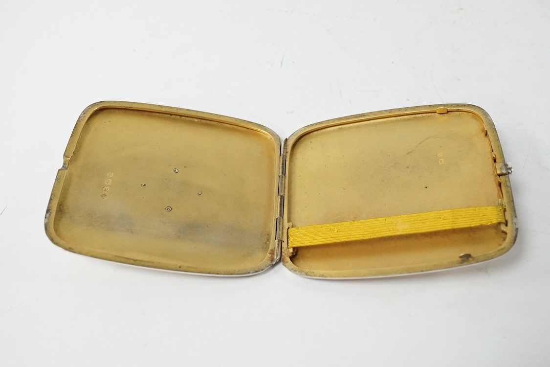An Edwardian silver cigarette case, with engraved inscription and yellow metal monogram appliqué 'JF', by Horace Woodward & Co, Birmingham, 1908, 90mm. Condition - fair to good